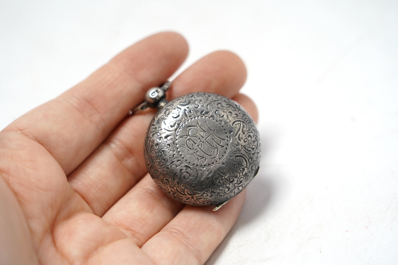 A late Victorian engraved silver sovereign case, Birmingham, 1898, diameter 34mm. Condition - fair